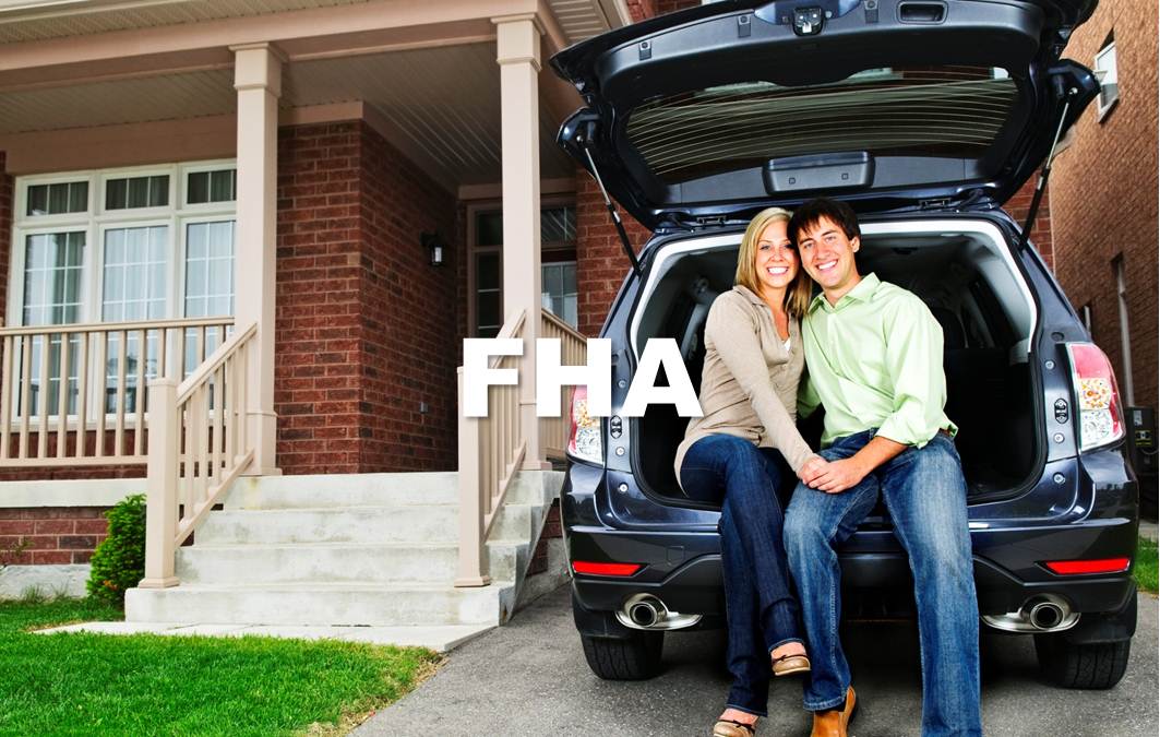 picture of couple sitting in the trunk of a car in front of home